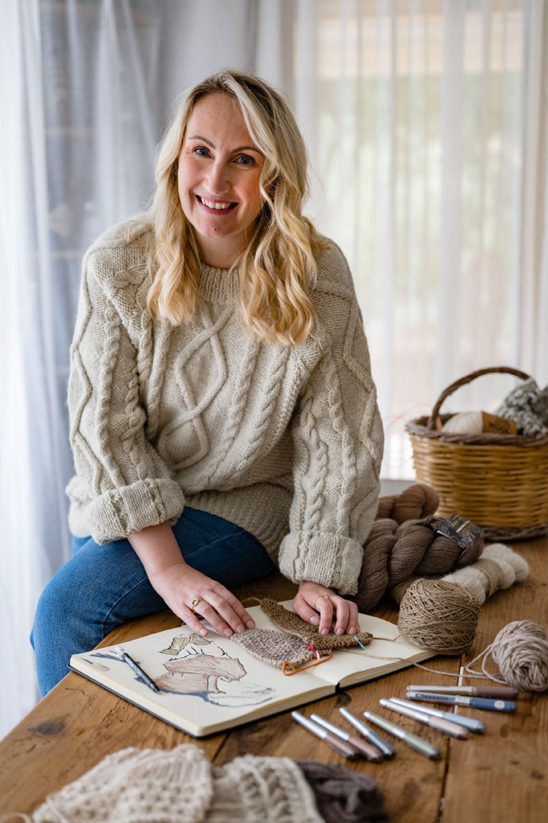 Louise Bollanos, the designer behind Handy Little Me, working with yarn and knitting projects