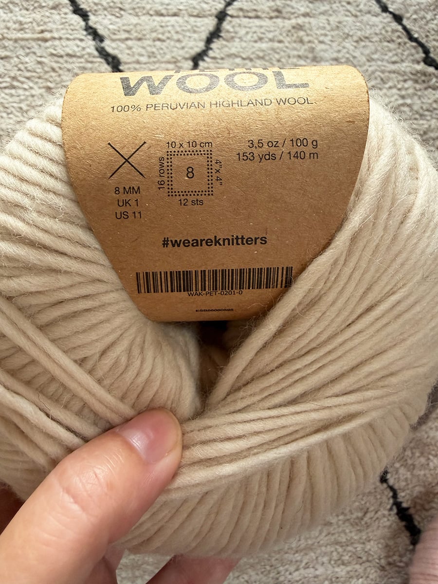 We Are Knitters Petite Wool label showing 8 mm needles, 12-stitch gauge and 140 meters per 100 grams.