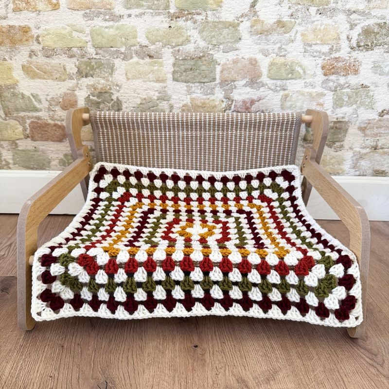Crochet cat blanket on chair