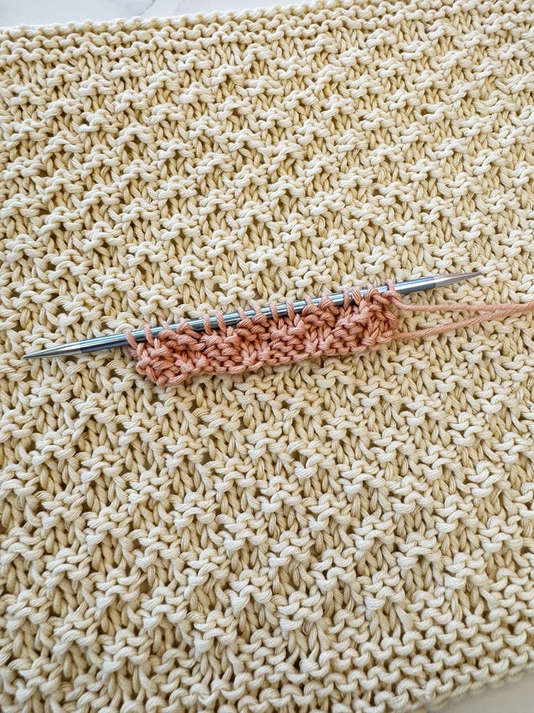 Detailed view of the raised knit and purl texture of double moss stitch