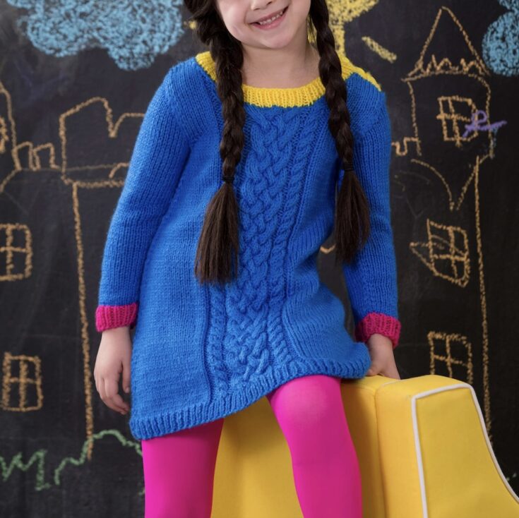 Free Red Heart Knit Girl’s Cabled Dress Pattern by Yarnspirations