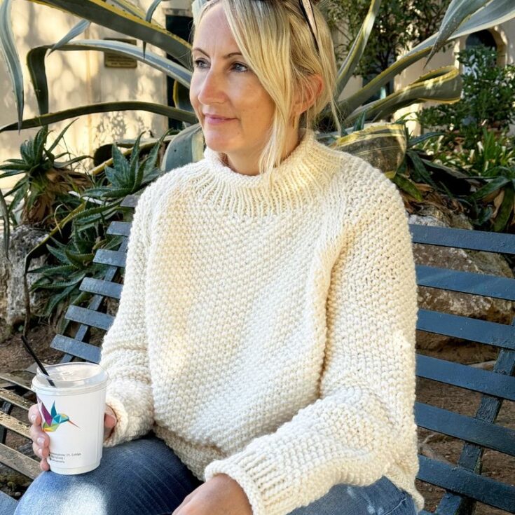 Louise wearing a knitted white sweater
