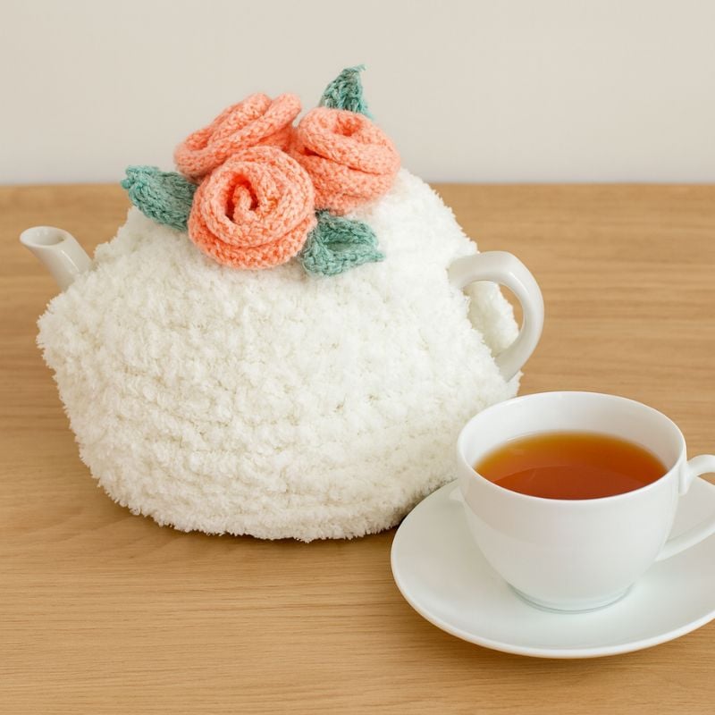 Tea cozy with knit flowers