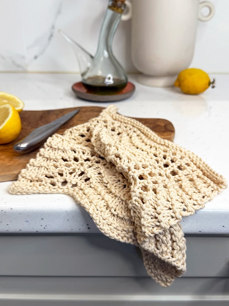 old shale knitted dishcloth on chopping board